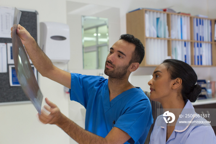 Doctor and nurse discussing x-ray in hospital