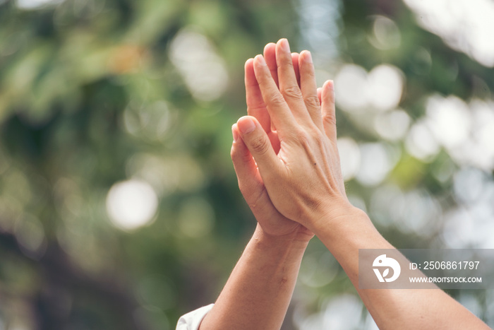 Teamwork high five as team together hands raise up greeting power tag teams. Diversity multiethnic t