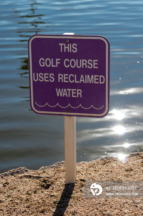 Purple golf course sign for recycled water