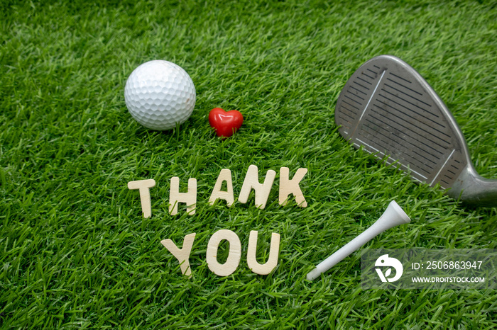 Thank you to golfer with golf ball and tee on green grass