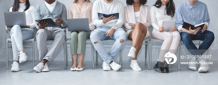 Cropped photo of diverse people sitting in line