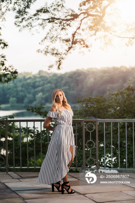 High School Senior Photo of Blonde Caucasian Girl Outdoors in Romper Dress