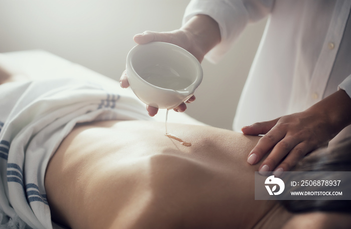 Woman relaxing with a massage in a spa center