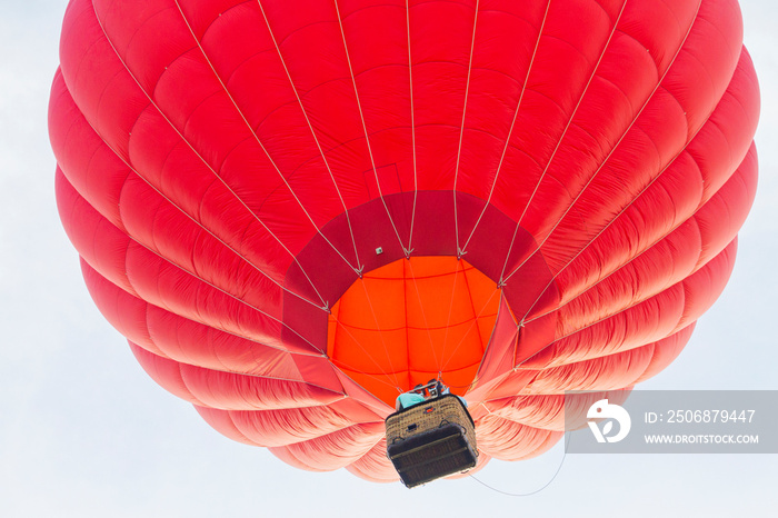 red balloon flies up in the sky