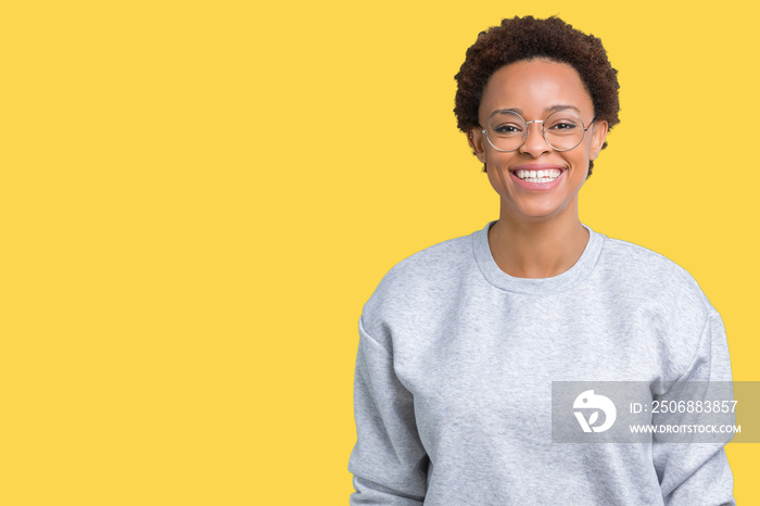 Young beautiful african american woman wearing glasses over isolated background with a happy and coo