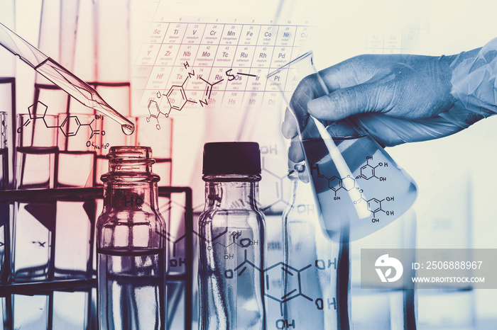 Researcher is dropping the reagent into test tube, with chemical equations background, in laboratory