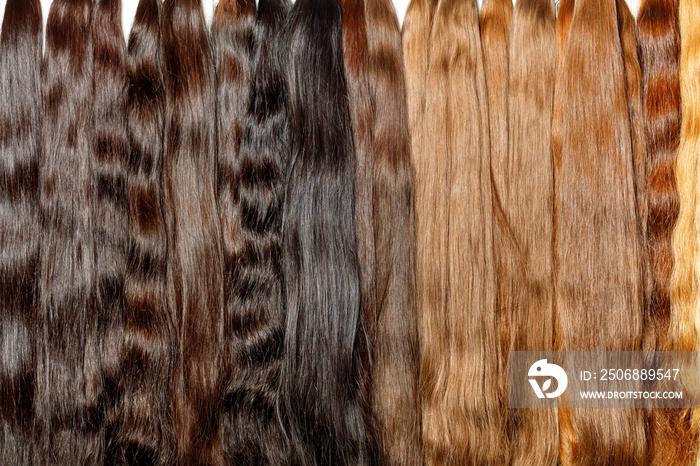 Bundles of healthy natural hair extensions, brown color, chocolate color, brown, shiny.