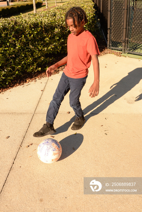 child playing foot ball