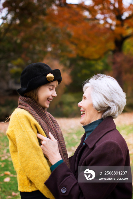 Grandmother with granddaughter (8-9) in park