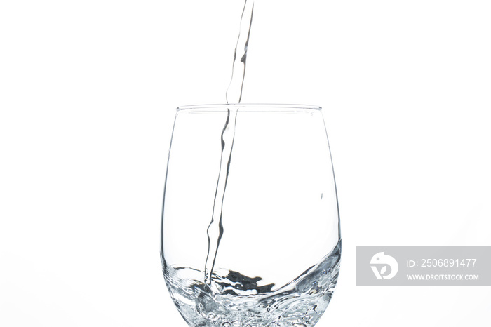 A glass of water on a white background. Close-up