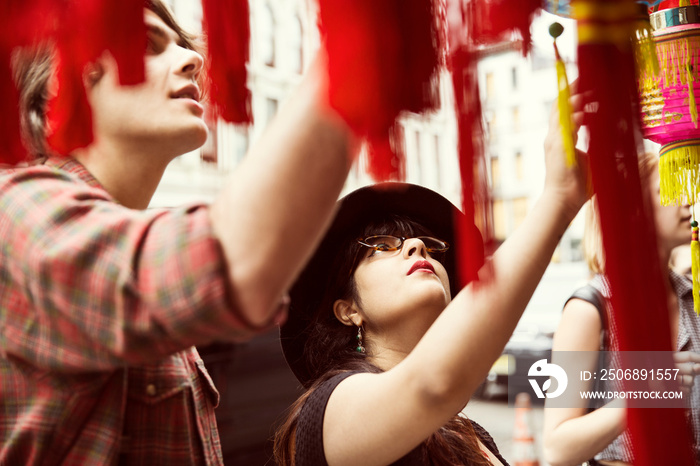 Young couple looking at chinese lanterns in city