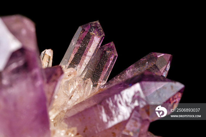 Macro of amethyst mineral stone on black background