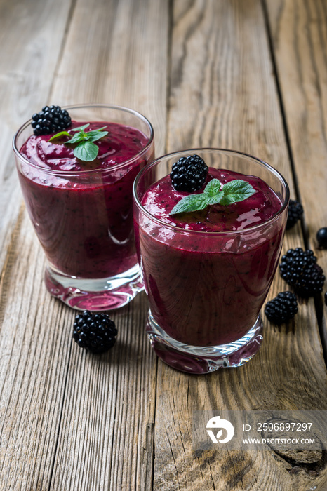 Berry smoothie in a glasses  on rustic background