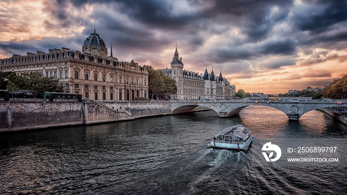 Conciergerie and Seine river in Paris at sunset