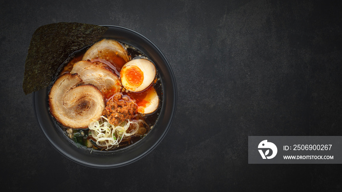 top view Asian ramen noodle soup with Chashu (Japanese braised pork belly), Nitamago egg, sliced spr