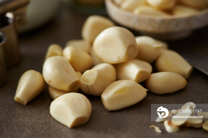 Peeled garlic background, studio shot