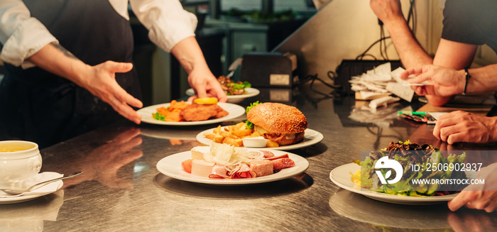 Food orders on the kitchen table in the restaurant