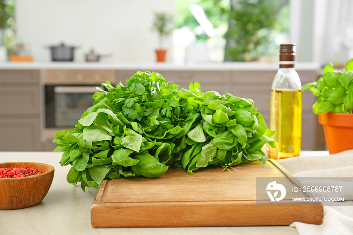 Different fresh herbs on table in kitchen