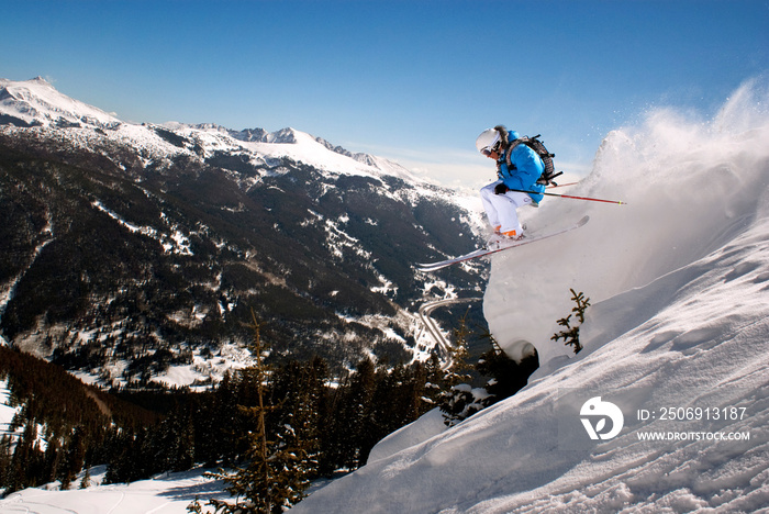 Side view of man skiing on snow covered mountain