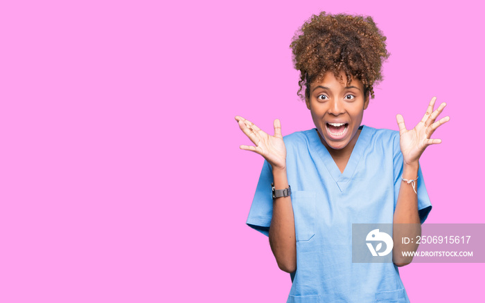 Young african american doctor woman over isolated background celebrating crazy and amazed for succes