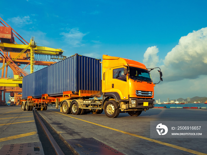 The container vessel  during discharging at an industrial port and move containers to container yard