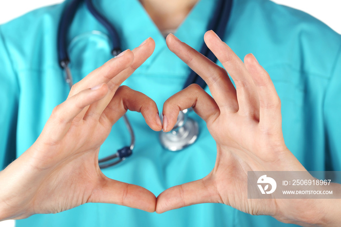 Doctors hands making heart shape close up