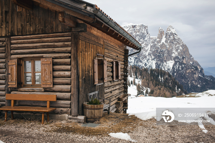 Wooden House in Alpine Mountain Landscape