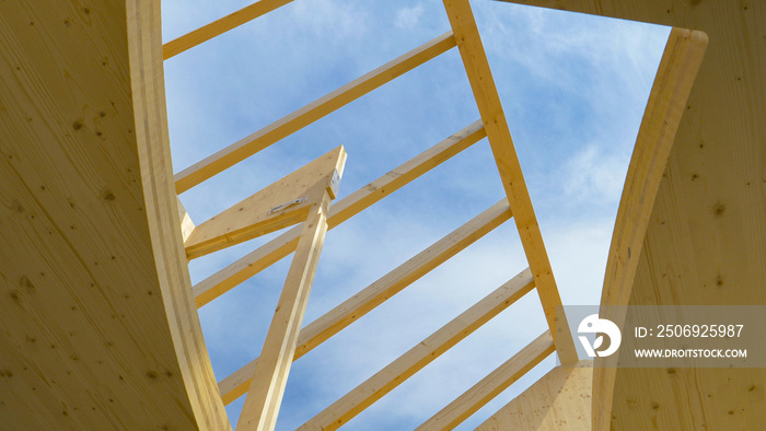 BOTTOM UP: Gentle sunbeams shine on the unfinished CLT house without a roof.