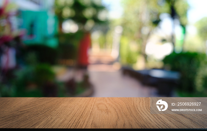 Empty dark wooden table in front of abstract blurred bokeh background of restaurant . can be used fo