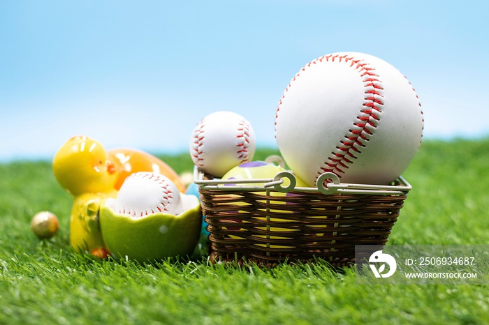 Baseball with Easter eggs are on green grass for Easter Holiday