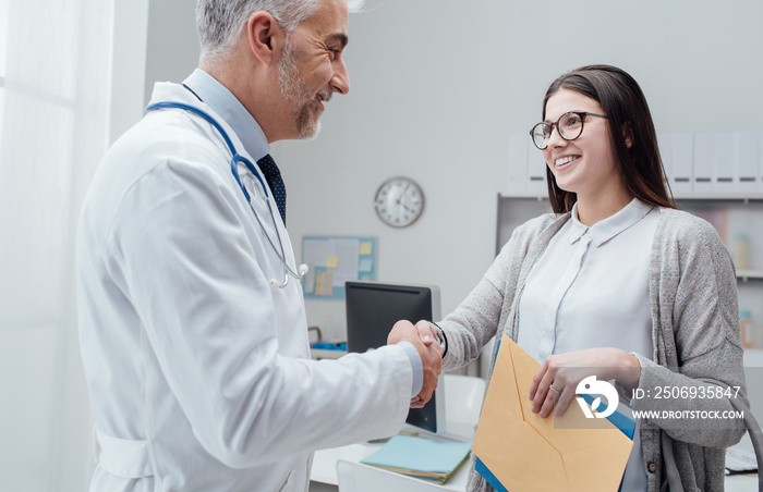 Doctor and patient shaking hands