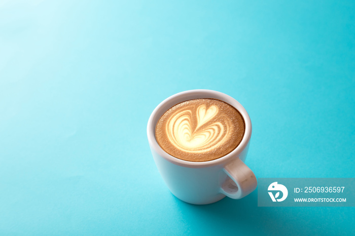 cup of coffee on blue background