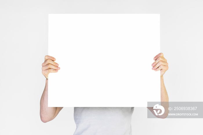 mens hands holding empty white poster, copy space