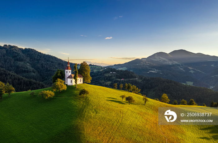 Skofja Loka, Slovenia - Aerial view of the beautiful hilltop Sveti Tomaz (Saint Thomas) church with 