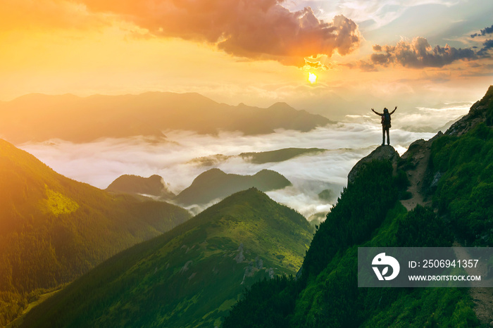 Wide mountain panorama. Small silhouette of tourist with backpack on rocky mountain slope with raise