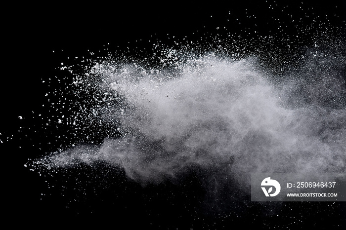 Freeze motion of white color powder exploding on dark background.