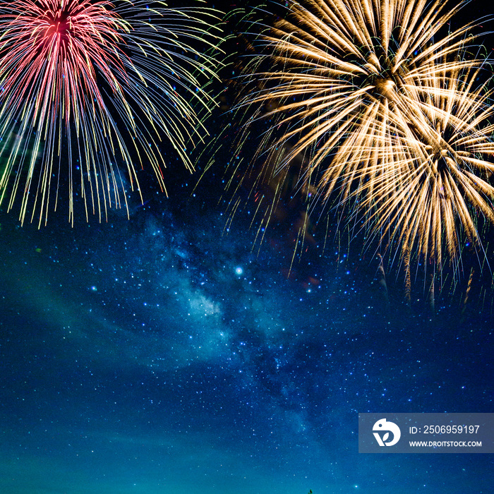 Christmas and New Year concept Beautiful fireworks against the background with the milky way stars