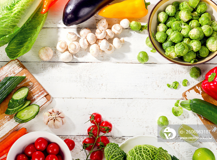 Raw organic vegetables  on a wooden background.