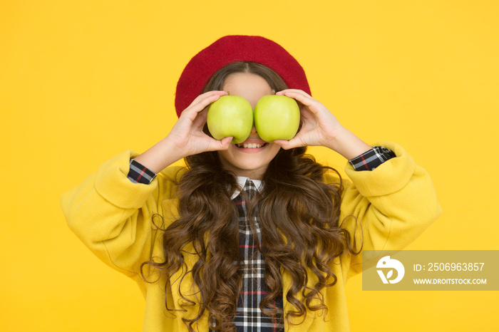 Fruit glasses. Little girl have fun with apples fruit yellow background. Small child hold healthy fr