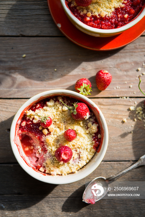 sweet pie. crumble with strawberries and red merry. Summer strawberry tart with crumble, top view