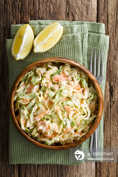 Coleslaw made of freshly shredded white cabbage and grated carrot with homemade mayonnaise-based sal