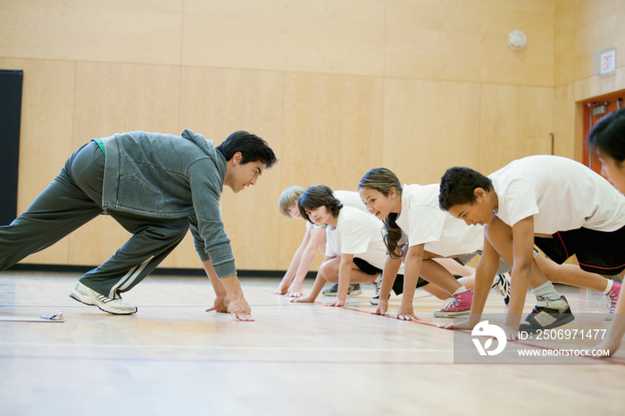 Teacher demonstrating sprinting position