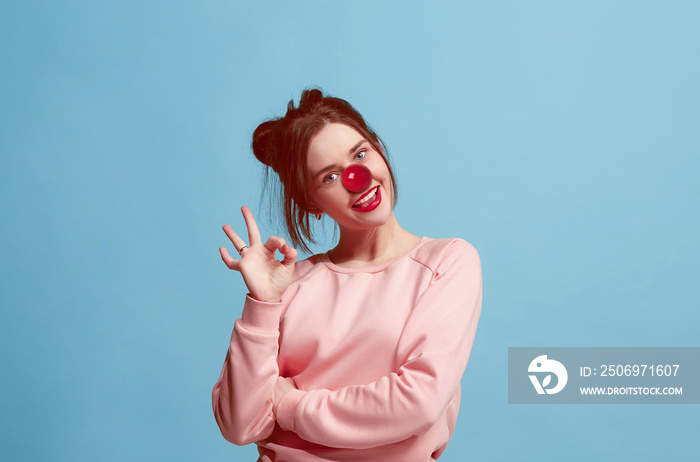 The happy surprised and smiling woman on red nose day. The clown, fun, party, celebration, funny, jo