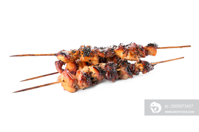 Grilled chicken skewers on white background