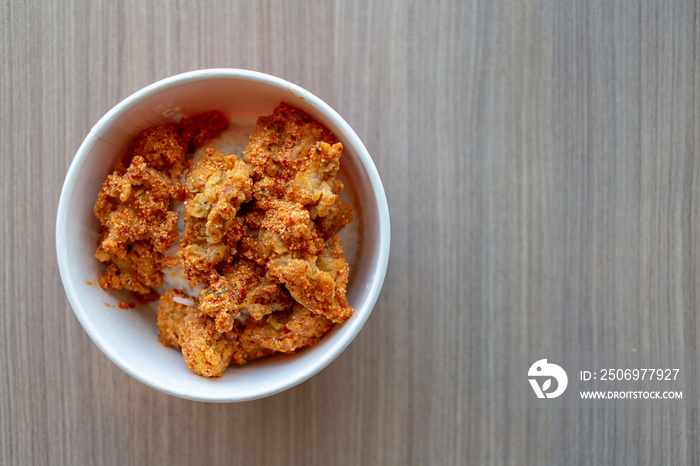 spicy pieces of chicken served with mixed rice.