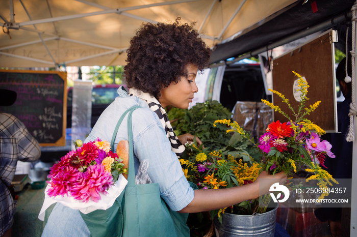 Mature woman buying flowers