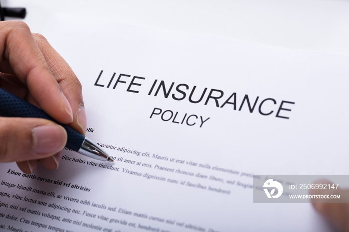 Person Filling Life Insurance Policy Form