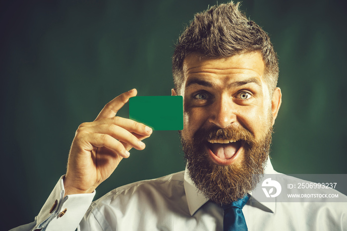 Business man presenting creditcard. Business branding. Serious bearded man with blank business card 