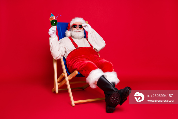 Portrait of his he nice handsome cheery bearded fat Santa father hipster guy sitting in chair relax 