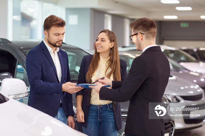 Sale, rental cars. A car dealer sells cars to customers.